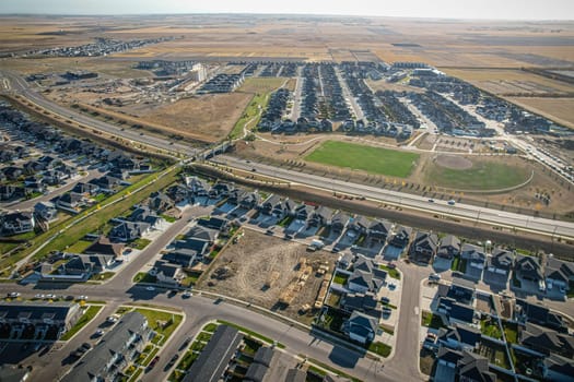Stunning bird's-eye perspective of the Evergreen neighborhood in Saskatoon, showcasing the unique urban layout and the natural beauty of Saskatchewan's landscapes.