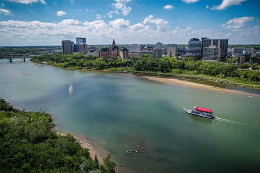 Aerial spectacle of downtown Saskatoon, revealing the city's architectural marvels, bustling streets, and the pulsating core of Saskatchewan's metropolis