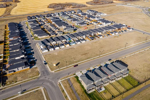 Discover Kensington in Saskatoon from a bird's-eye view. This drone image highlights the neighborhood's modern architecture, green spaces, and the lively, community-focused atmosphere.
