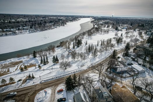 Aerial spectacle of downtown Saskatoon, revealing the city's architectural marvels, bustling streets, and the pulsating core of Saskatchewan's metropolis