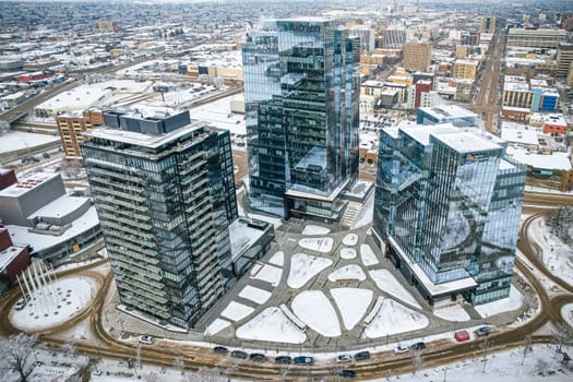 Aerial spectacle of downtown Saskatoon, revealing the city's architectural marvels, bustling streets, and the pulsating core of Saskatchewan's metropolis