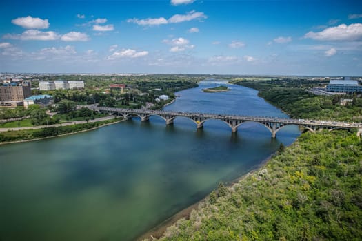 Aerial spectacle of downtown Saskatoon, revealing the city's architectural marvels, bustling streets, and the pulsating core of Saskatchewan's metropolis