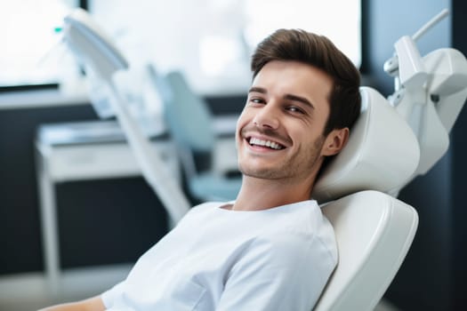 European young man smiling happily while sitting in medical chair at dental clinic. AI Generated