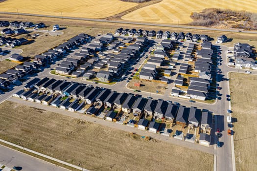 Discover Kensington in Saskatoon from a bird's-eye view. This drone image highlights the neighborhood's modern architecture, green spaces, and the lively, community-focused atmosphere.