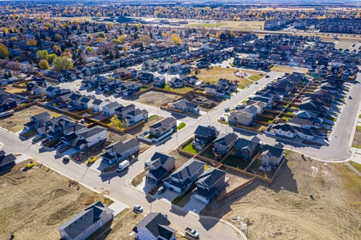Discover Kensington in Saskatoon from a bird's-eye view. This drone image highlights the neighborhood's modern architecture, green spaces, and the lively, community-focused atmosphere.