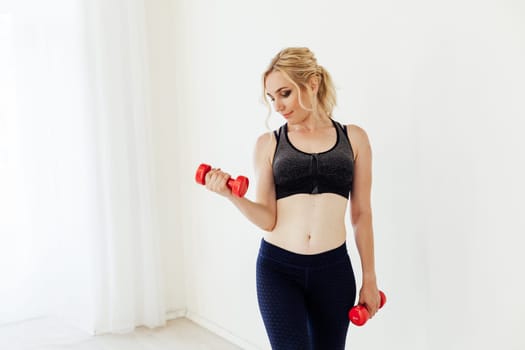 Female engaged in fitness with dumbbells sport