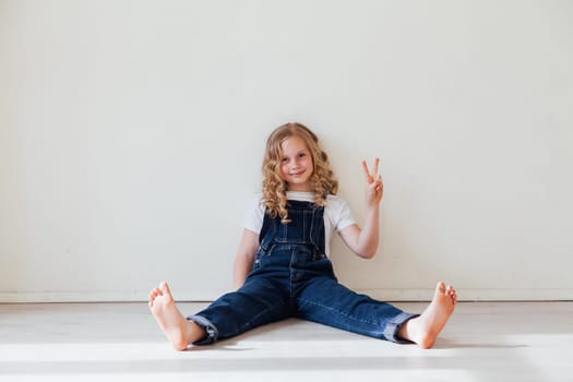 Girl in denim bandreveal shows off two fingers