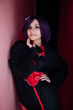 portrait of a woman anime cosplayer with purple hair