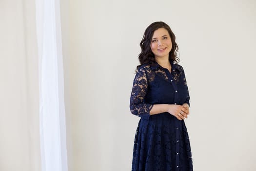 Portrait of a beautiful Asian woman in a blue dress