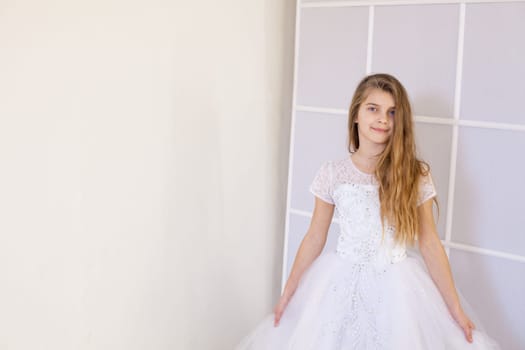 Portrait of a girl in a white ball gown