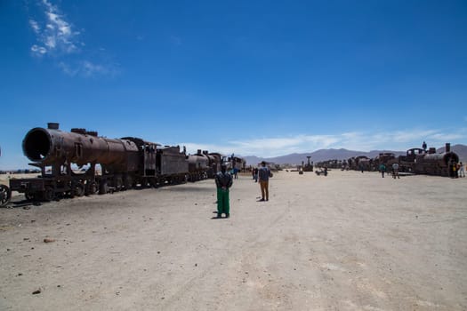 Uyuni, Bolivia - November 1, 2015: Old and rusting antique train carriages at the train cemetery.