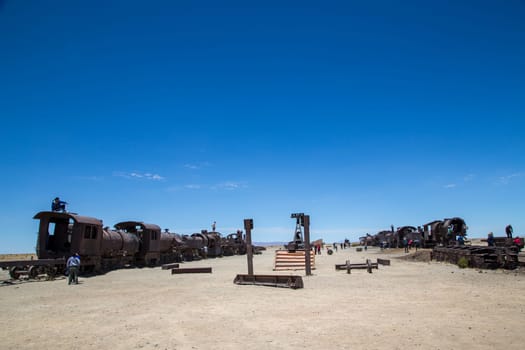 Uyuni, Bolivia - November 1, 2015: Old and rusting antique train carriages at the train cemetery.