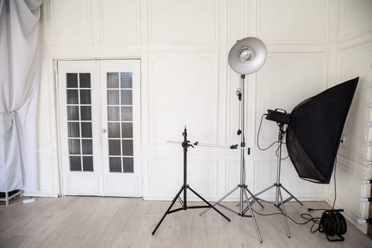 photo studio interior with flashes and racks