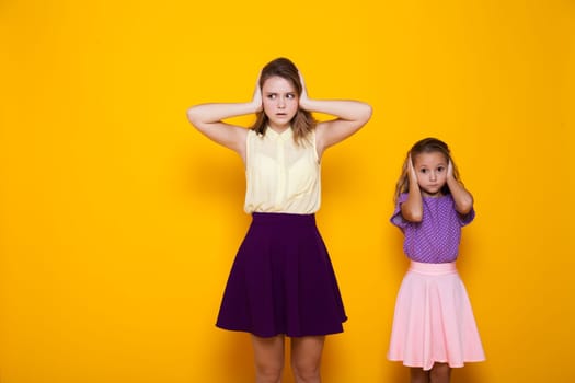 Two fashionable sister girls of different ages