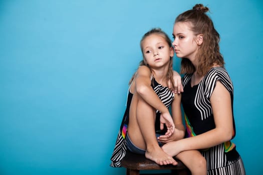 Two fashionable sister girls of different ages