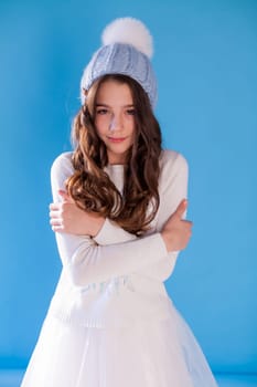 portrait of a beautiful girl in a winter hat