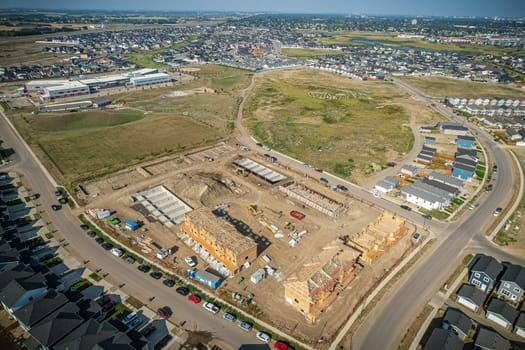 Elevated view of Rosewood neighborhood in Saskatoon, presenting a tapestry of urban design intertwined with Saskatchewan's serene natural canvas.