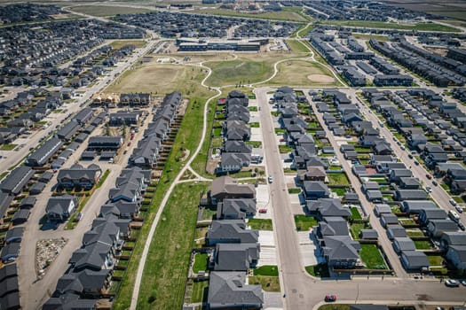 Stunning bird's-eye perspective of the Evergreen neighborhood in Saskatoon, showcasing the unique urban layout and the natural beauty of Saskatchewan's landscapes.