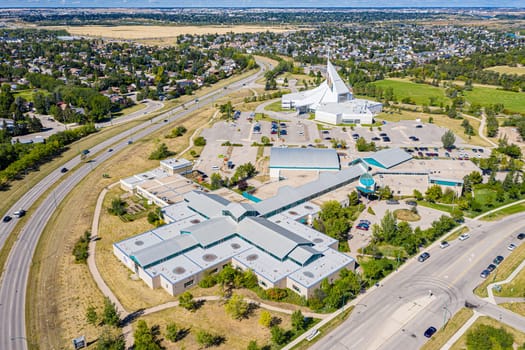 Explore the lush Forest Grove neighborhood in Saskatoon from an aerial perspective. This drone image captures the area's verdant charm, peaceful streets, and community warmth, under the vast Saskatchewan sky.