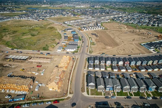 Elevated view of Rosewood neighborhood in Saskatoon, presenting a tapestry of urban design intertwined with Saskatchewan's serene natural canvas.