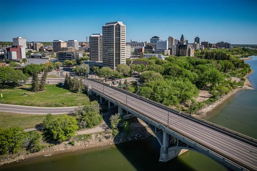 Aerial spectacle of downtown Saskatoon, revealing the city's architectural marvels, bustling streets, and the pulsating core of Saskatchewan's metropolis