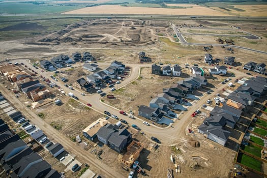 Elevated view of Rosewood neighborhood in Saskatoon, presenting a tapestry of urban design intertwined with Saskatchewan's serene natural canvas.
