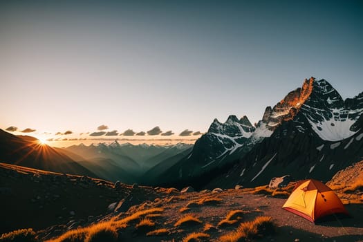 Camping tent high in the mountains at sunset.