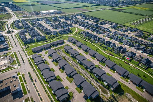 Stunning bird's-eye perspective of the Evergreen neighborhood in Saskatoon, showcasing the unique urban layout and the natural beauty of Saskatchewan's landscapes.