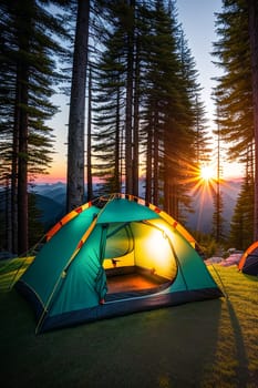 Camping tent high in the mountains at sunset.
