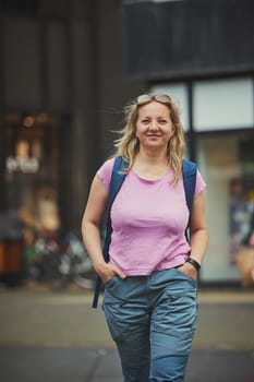 Beautiful woman walking around the city in the Netherlands.