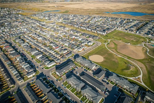 Stunning bird's-eye perspective of the Evergreen neighborhood in Saskatoon, showcasing the unique urban layout and the natural beauty of Saskatchewan's landscapes.