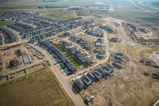 Elevated view of Rosewood neighborhood in Saskatoon, presenting a tapestry of urban design intertwined with Saskatchewan's serene natural canvas.