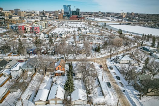 Aerial spectacle of downtown Saskatoon, revealing the city's architectural marvels, bustling streets, and the pulsating core of Saskatchewan's metropolis