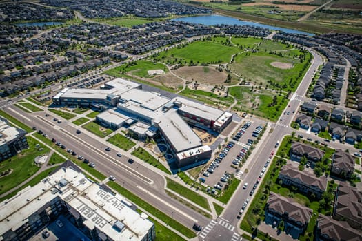Captivating aerial shot of Stonebridge in Saskatoon, highlighting the harmonious blend of modern architecture and Saskatchewan's verdant surroundings.