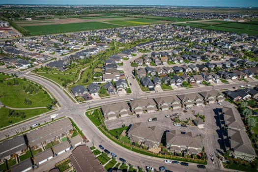 Elevated panorama of Willowgrove, showcasing the neighborhood's modern aesthetics intertwined with pockets of lush green, epitomizing Saskatoon's suburban beauty