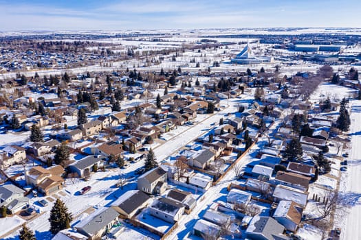 Explore the lush Forest Grove neighborhood in Saskatoon from an aerial perspective. This drone image captures the area's verdant charm, peaceful streets, and community warmth, under the vast Saskatchewan sky.