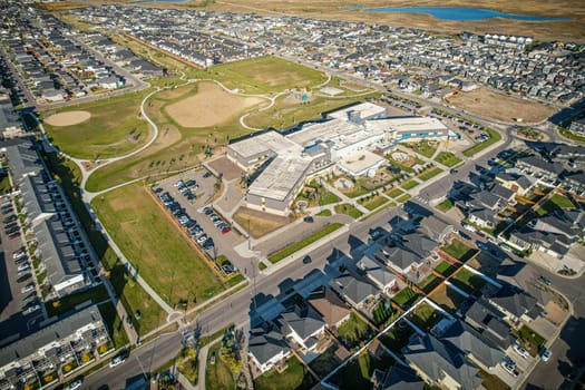 Stunning bird's-eye perspective of the Evergreen neighborhood in Saskatoon, showcasing the unique urban layout and the natural beauty of Saskatchewan's landscapes.