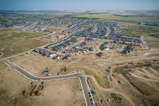 Elevated view of Rosewood neighborhood in Saskatoon, presenting a tapestry of urban design intertwined with Saskatchewan's serene natural canvas.