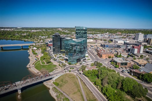 Aerial spectacle of downtown Saskatoon, revealing the city's architectural marvels, bustling streets, and the pulsating core of Saskatchewan's metropolis
