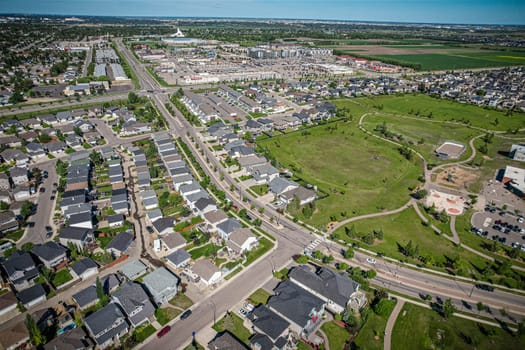 Elevated panorama of Willowgrove, showcasing the neighborhood's modern aesthetics intertwined with pockets of lush green, epitomizing Saskatoon's suburban beauty
