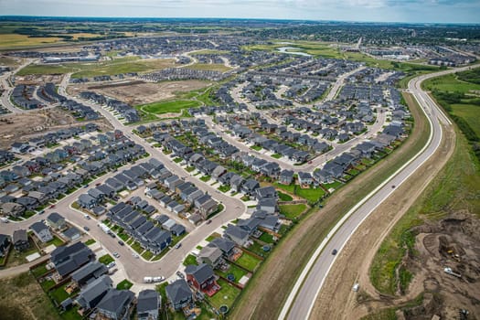 Elevated view of Rosewood neighborhood in Saskatoon, presenting a tapestry of urban design intertwined with Saskatchewan's serene natural canvas.
