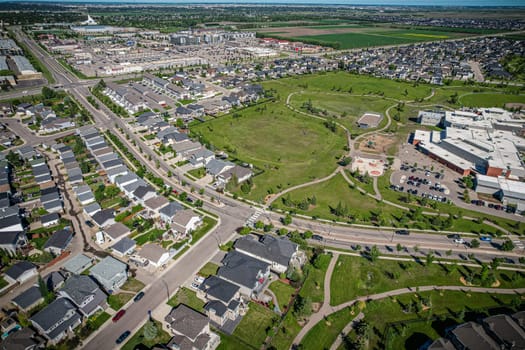 Elevated panorama of Willowgrove, showcasing the neighborhood's modern aesthetics intertwined with pockets of lush green, epitomizing Saskatoon's suburban beauty