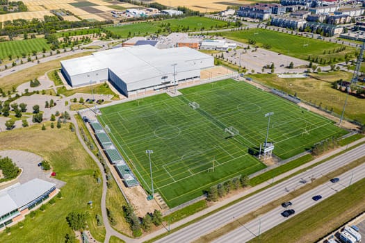 Explore the lush Forest Grove neighborhood in Saskatoon from an aerial perspective. This drone image captures the area's verdant charm, peaceful streets, and community warmth, under the vast Saskatchewan sky.