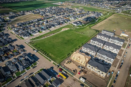 Stunning bird's-eye perspective of the Evergreen neighborhood in Saskatoon, showcasing the unique urban layout and the natural beauty of Saskatchewan's landscapes.