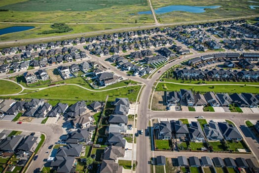Stunning bird's-eye perspective of the Evergreen neighborhood in Saskatoon, showcasing the unique urban layout and the natural beauty of Saskatchewan's landscapes.