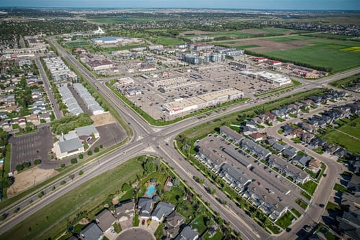 Elevated panorama of Willowgrove, showcasing the neighborhood's modern aesthetics intertwined with pockets of lush green, epitomizing Saskatoon's suburban beauty