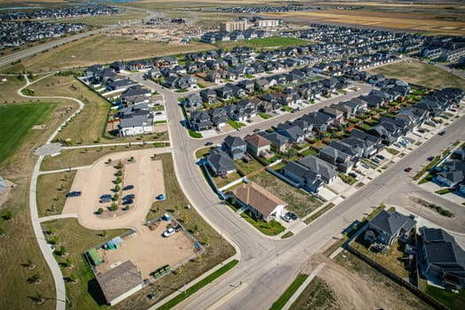 Stunning bird's-eye perspective of the Evergreen neighborhood in Saskatoon, showcasing the unique urban layout and the natural beauty of Saskatchewan's landscapes.