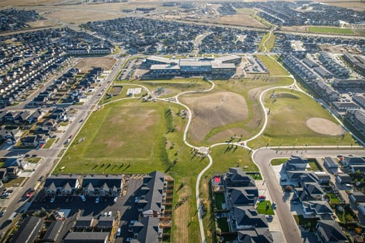 Stunning bird's-eye perspective of the Evergreen neighborhood in Saskatoon, showcasing the unique urban layout and the natural beauty of Saskatchewan's landscapes.