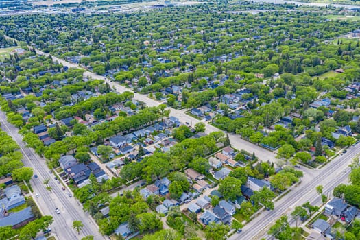 Explore Buena Vista from the skies with this stunning drone image. Capturing Saskatoon's serene neighborhood, it highlights lush parks, quaint streets, and a harmonious community, all from an elevated perspective.