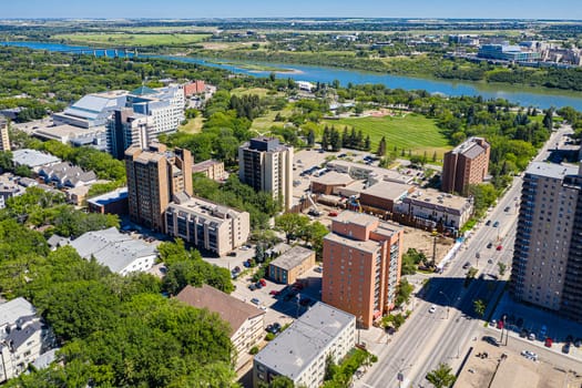 Discover the vibrant City Park neighborhood in Saskatoon from above. This drone image captures its lush green spaces, historic charm, and lively urban atmosphere, offering a unique aerial perspective.